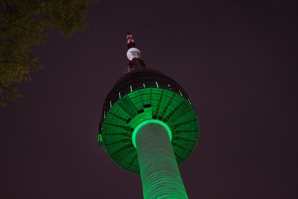 green and white tower under blue sky