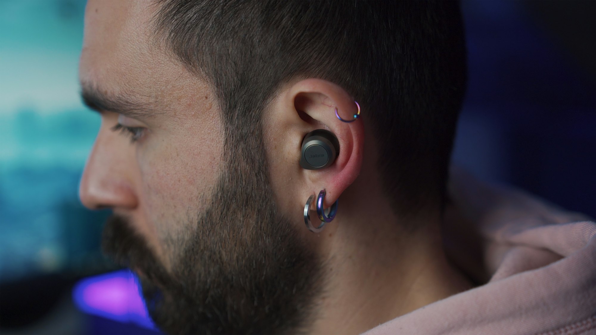 Man listening to music through wireless earphones