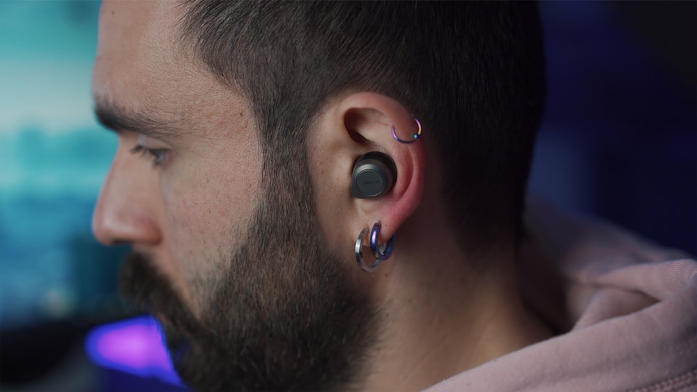 man with silver stud earring