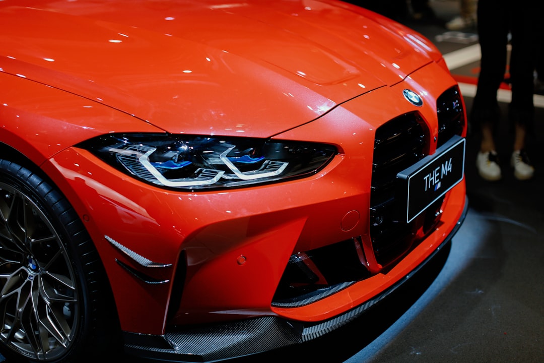 orange mercedes benz car with open hood