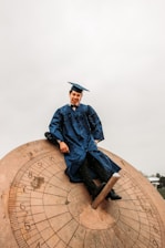 man in blue academic robe statue