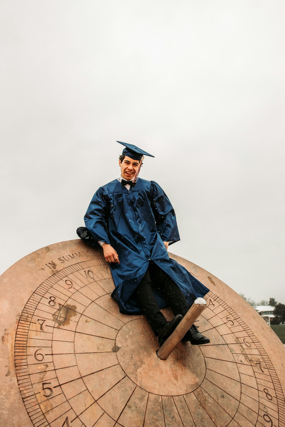 man in blue academic robe statue