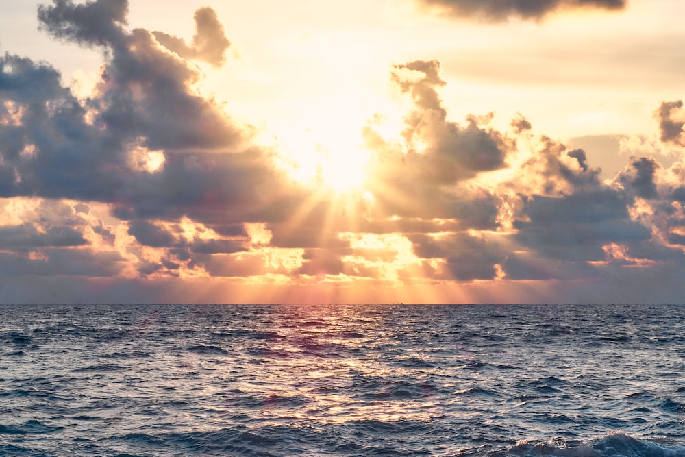 sea waves under cloudy sky during daytime