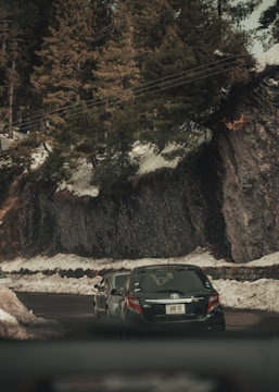 Toyota Taisor in motion on a mountain road.