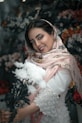 woman in white and brown floral hijab