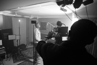 man in black jacket taking photo of man in black jacket