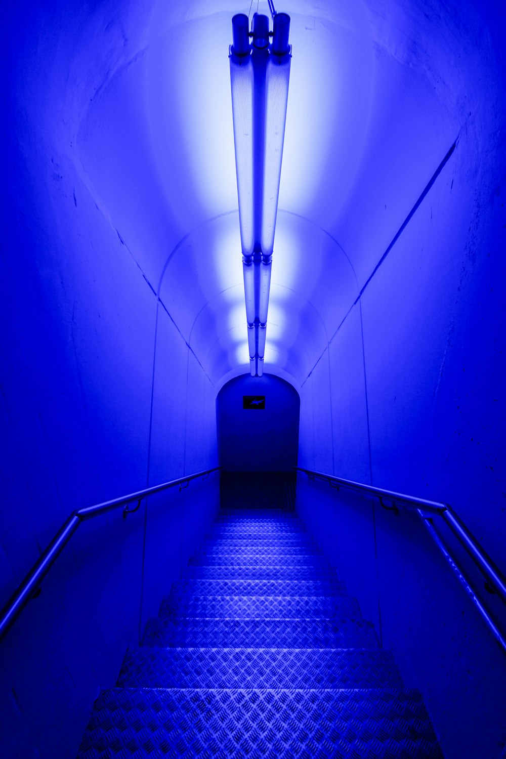 blue and white staircase with blue wall