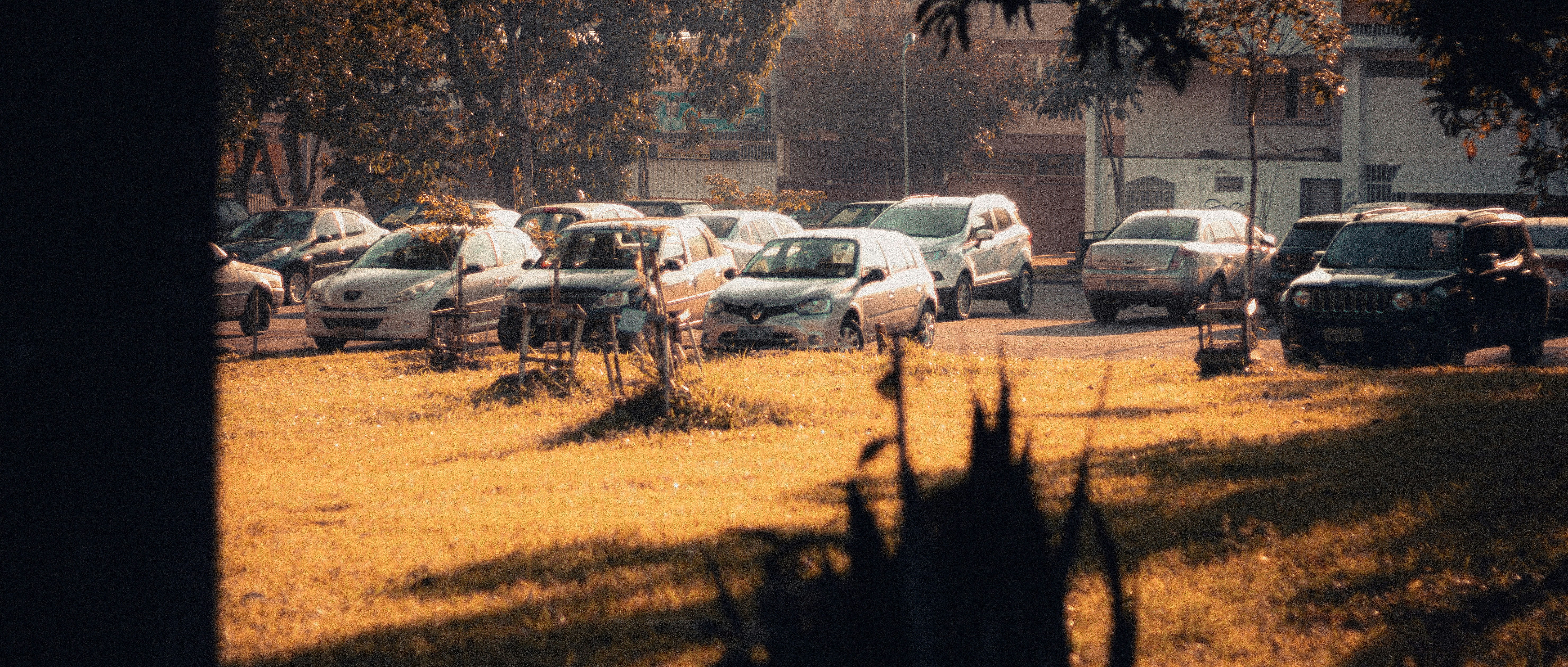 cars parked on parking lot during daytime