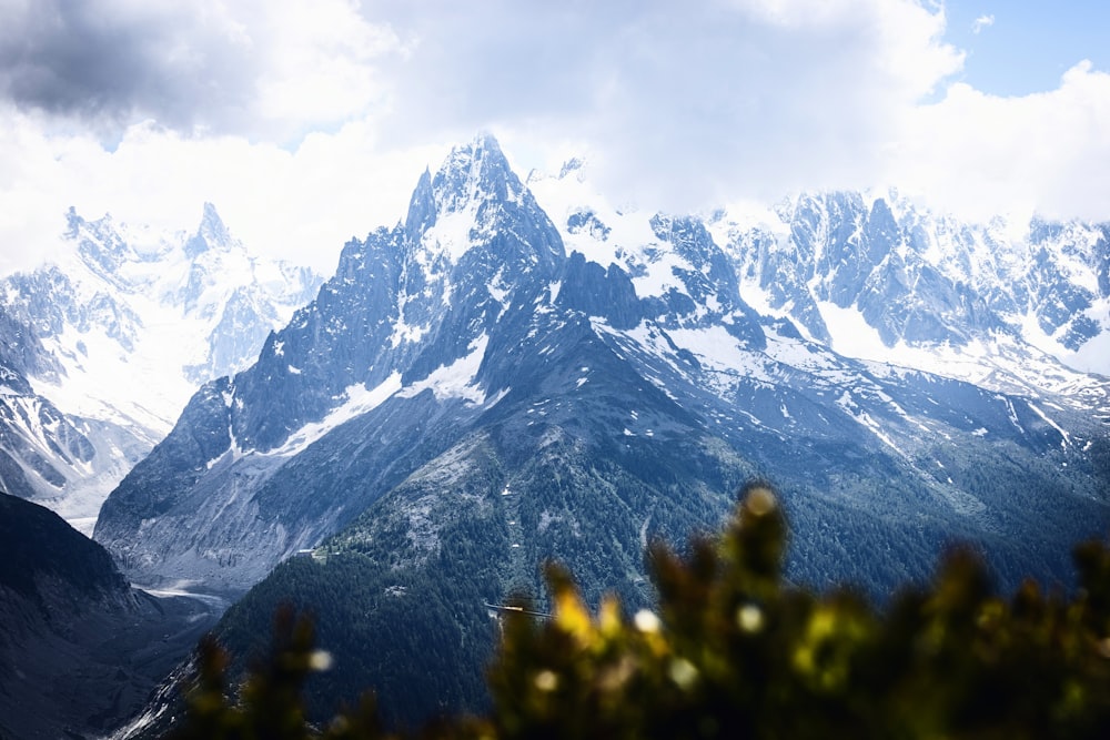 snow covered mountain under cloudy sky during daytime