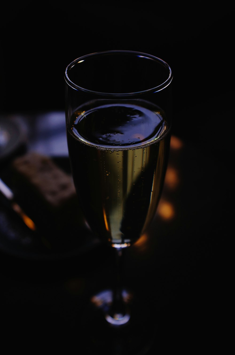 clear drinking glass with yellow liquid