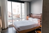 white bed linen on bed
