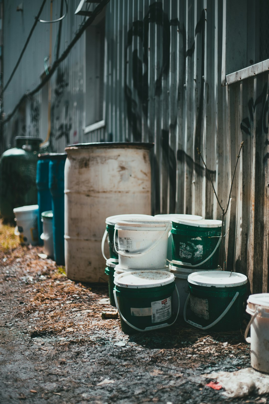 white and green plastic bucket