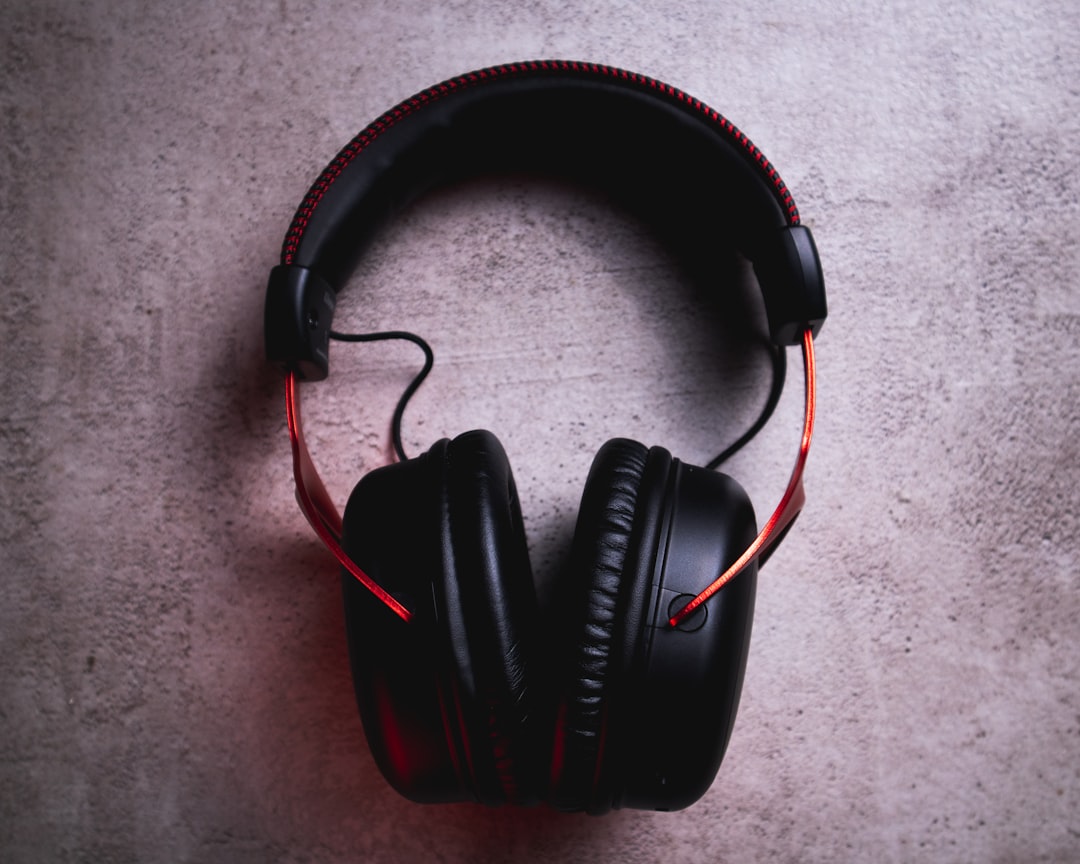 black and red corded headphones,