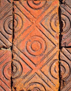 Close-up of intricate patterns on freshly crafted tabriz tiles drying in natural light.