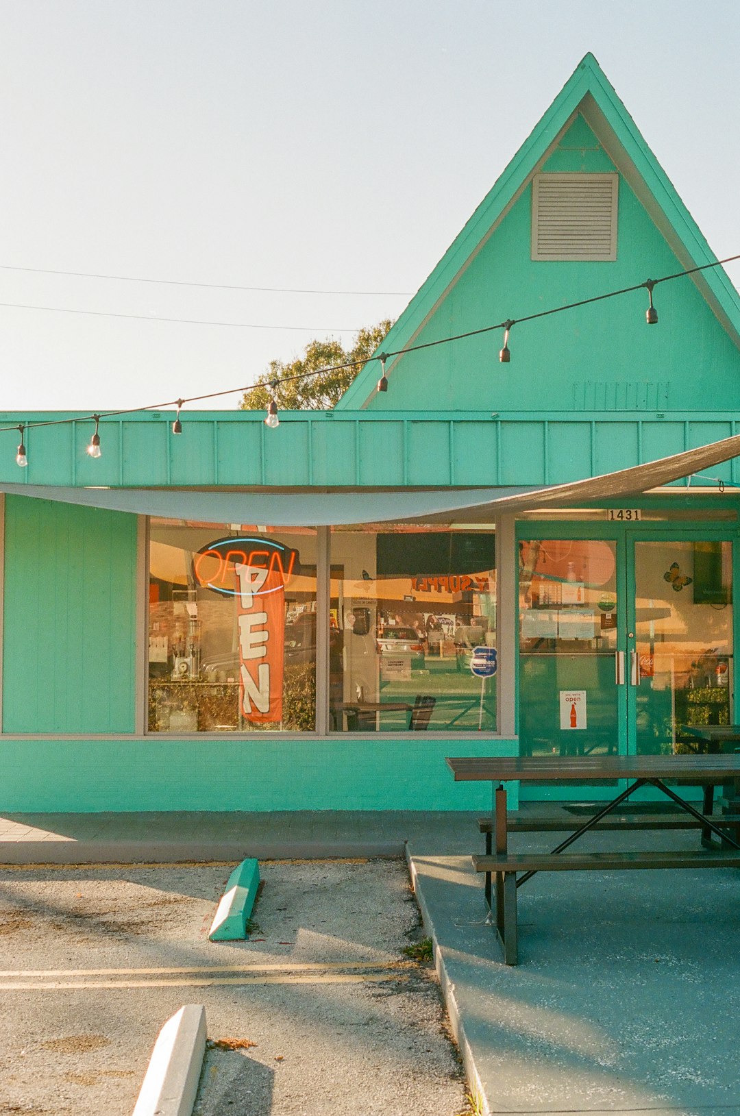 green and white store front during daytime