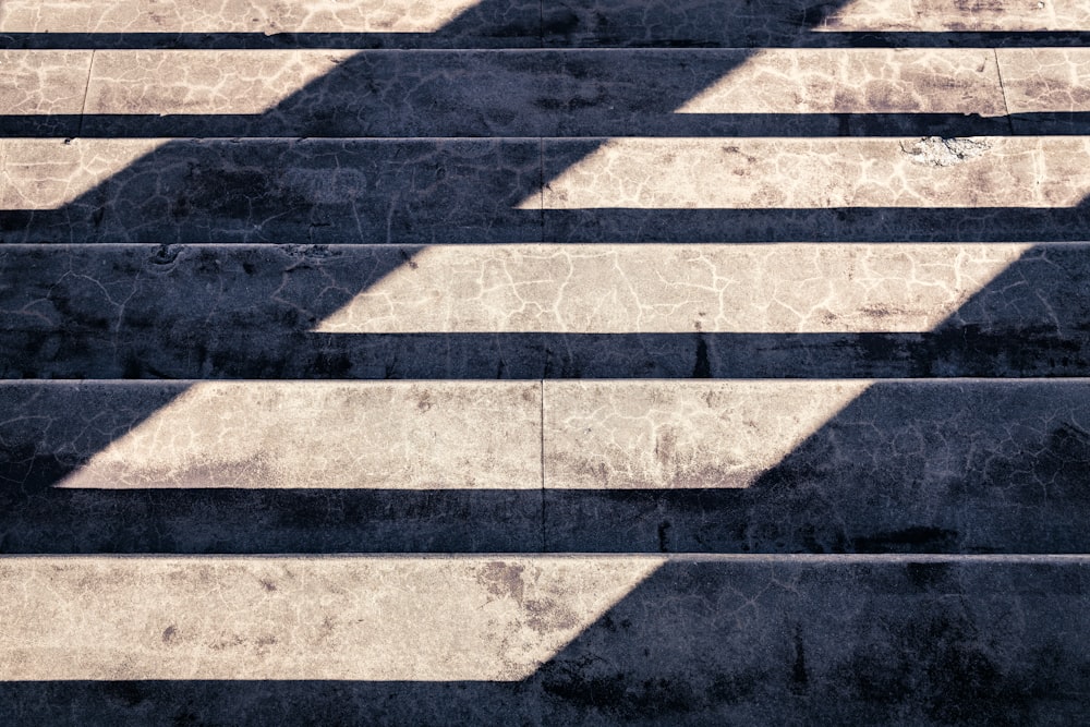 shadow of person on gray concrete pavement