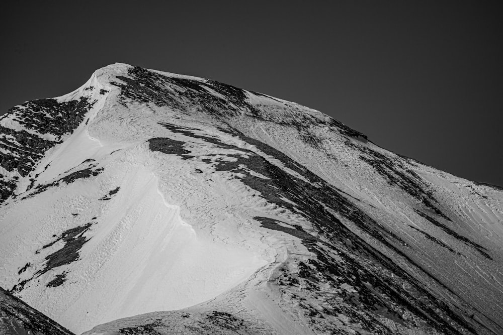 snow covered mountain during daytime