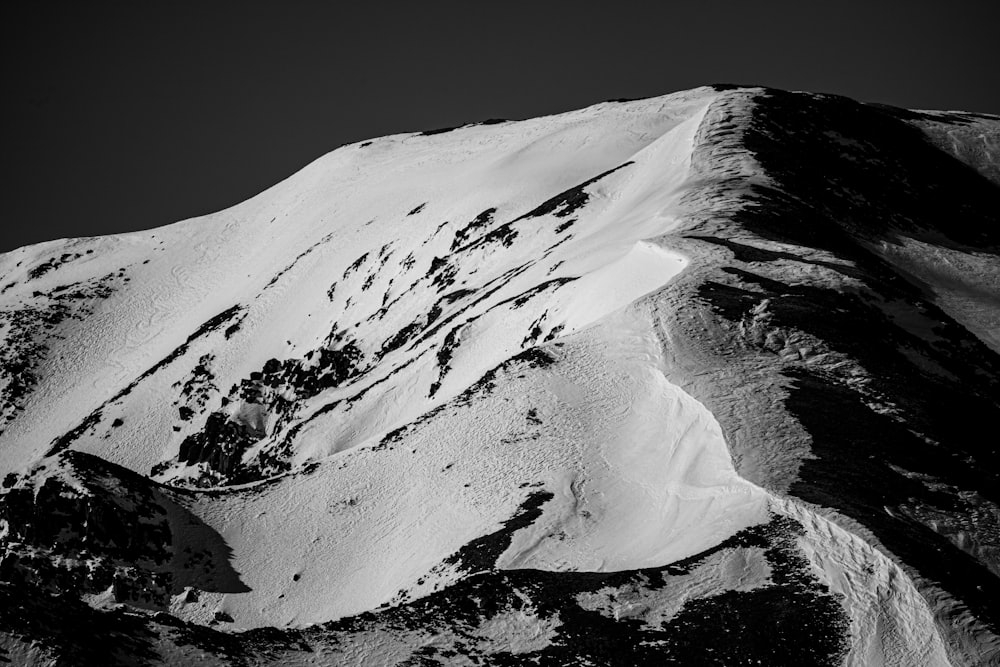 grayscale photo of snow covered mountain