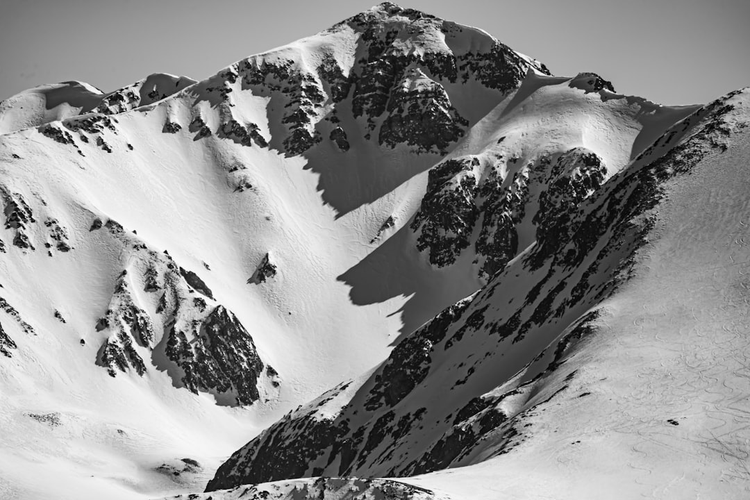 snow covered mountain during daytime