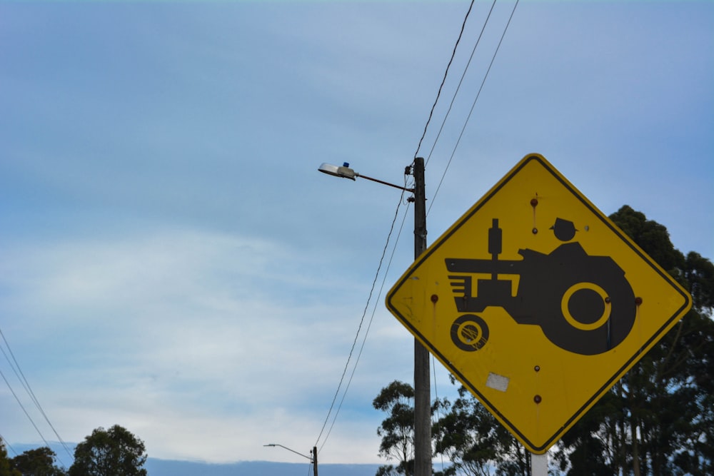 yellow and black street sign