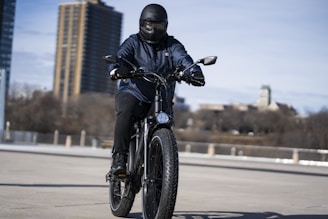 man in black motorcycle helmet riding motorcycle on road during daytime