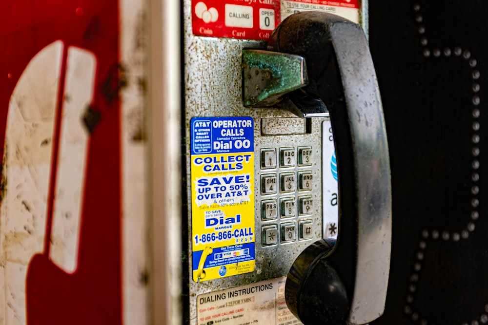 yellow and black telephone on white wall