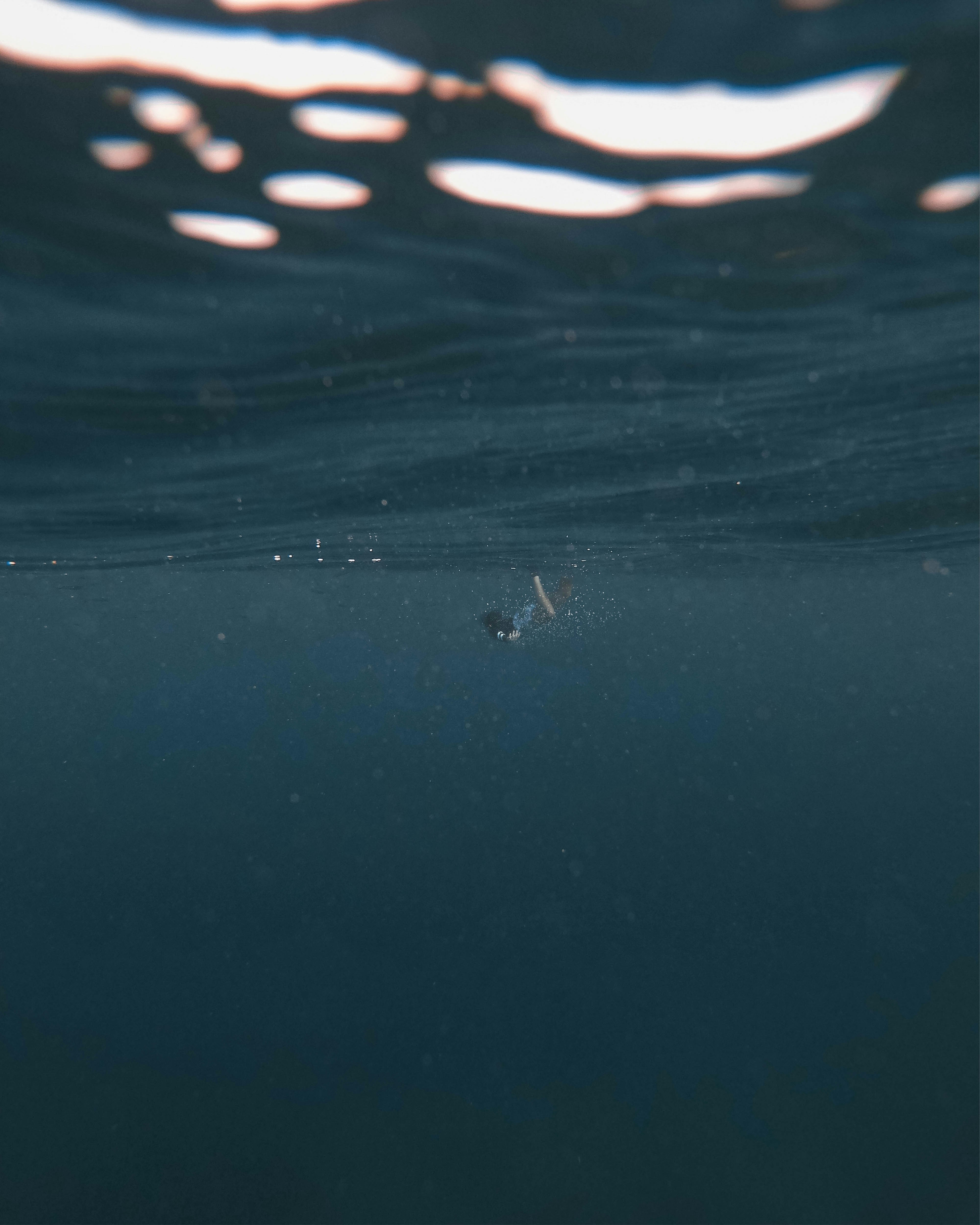 Diver going down into the ocean