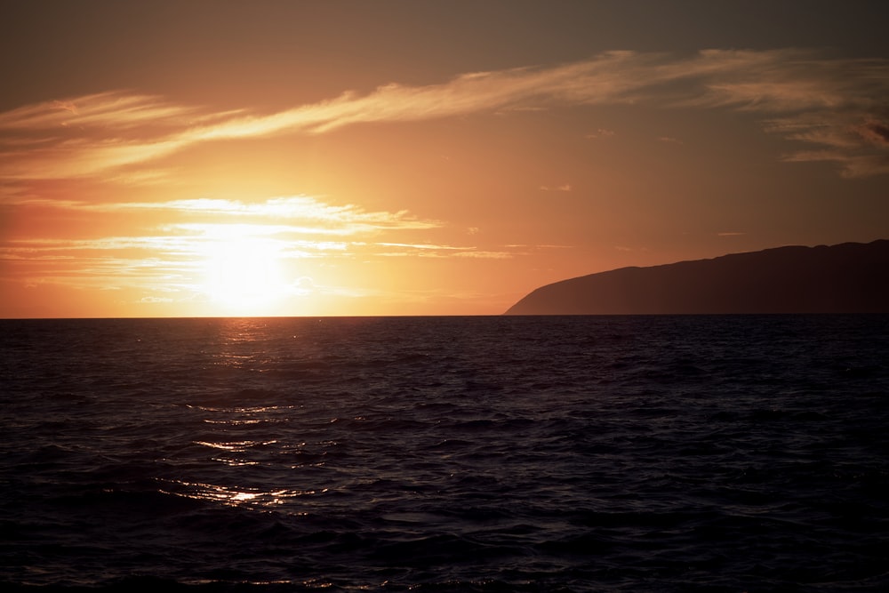 silhouette of mountain during sunset