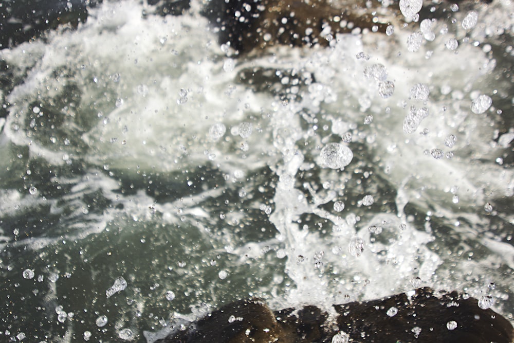 water splash on brown rock