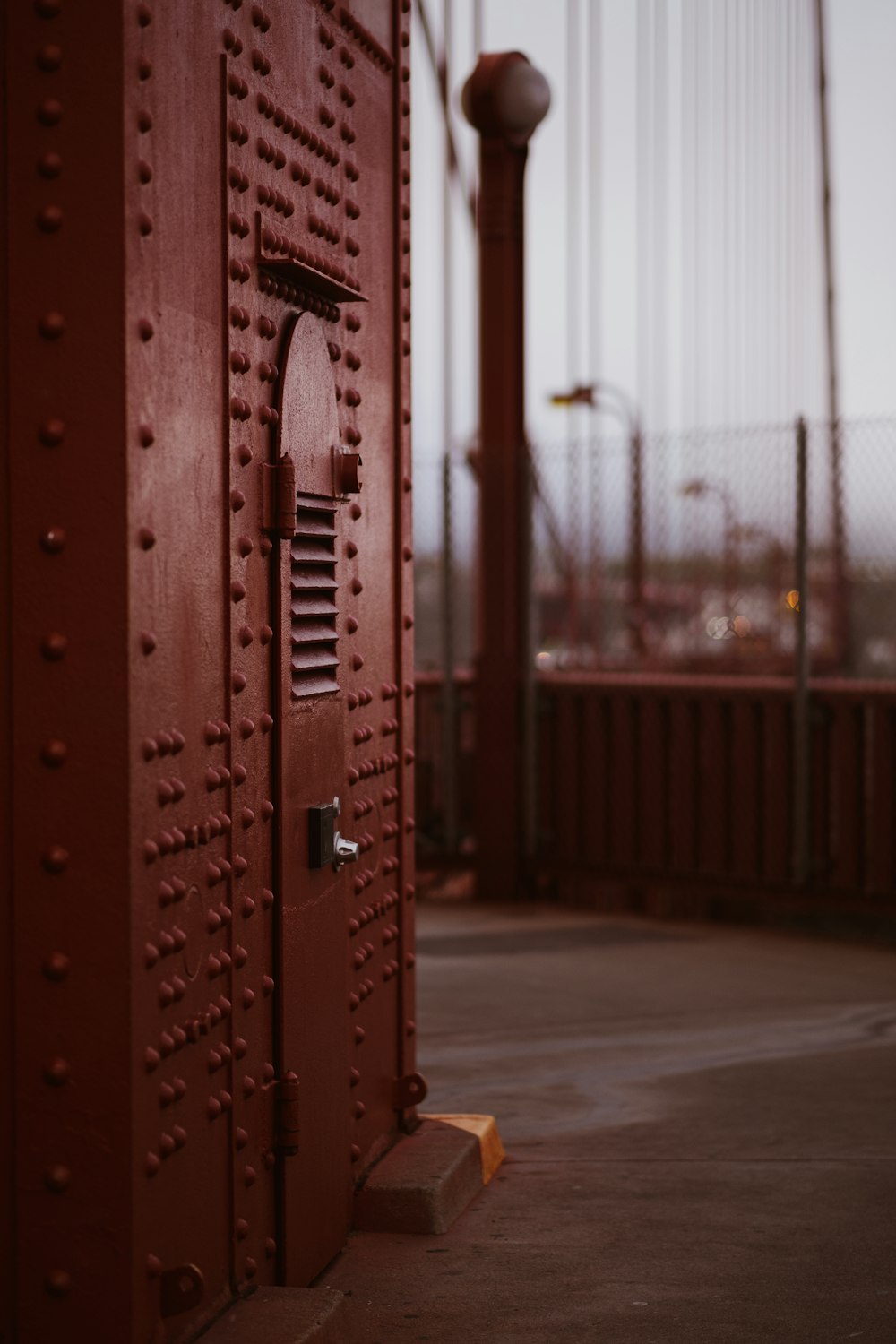 red steel gate during daytime