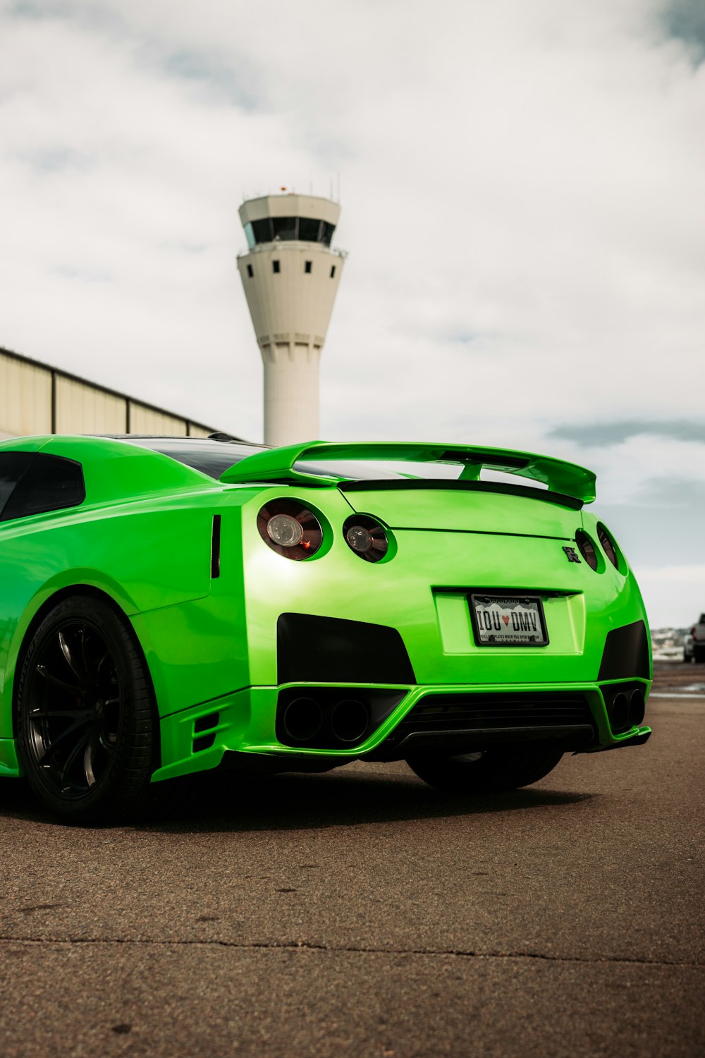 green bmw m 3 coupe parked on parking lot during daytime