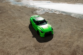 green car on rough terrain enjoying the durable michelin latitude tyres sold at tyrepiblic nigeria