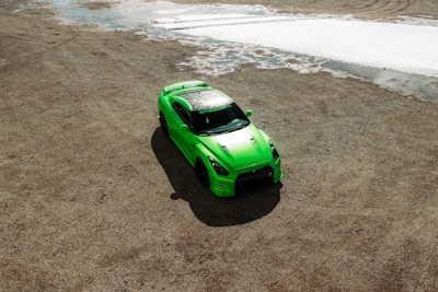 green car on rough terrain enjoying the durable michelin latitude tyres sold at tyrepiblic nigeria