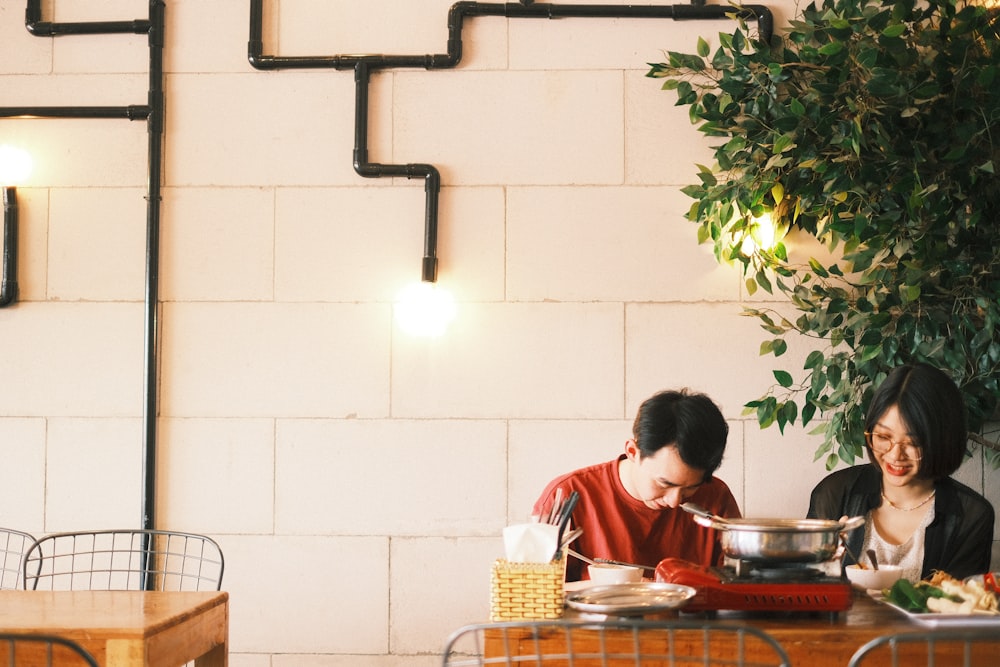 boy in red and white shirt sitting on chair