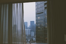 View from the hotel room balcony showing the vibrant cityscape of Dhaka.