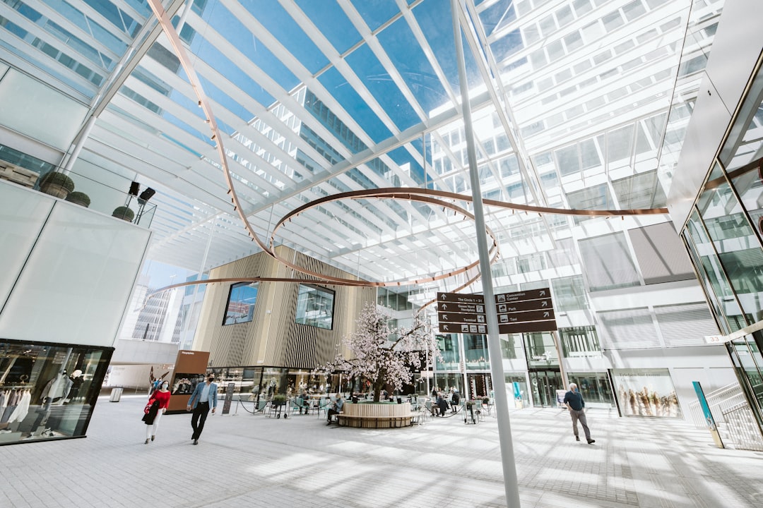 people walking on white concrete building during daytime