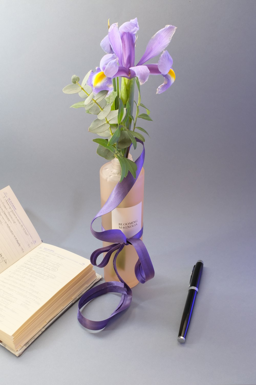 purple flowers in vase on table