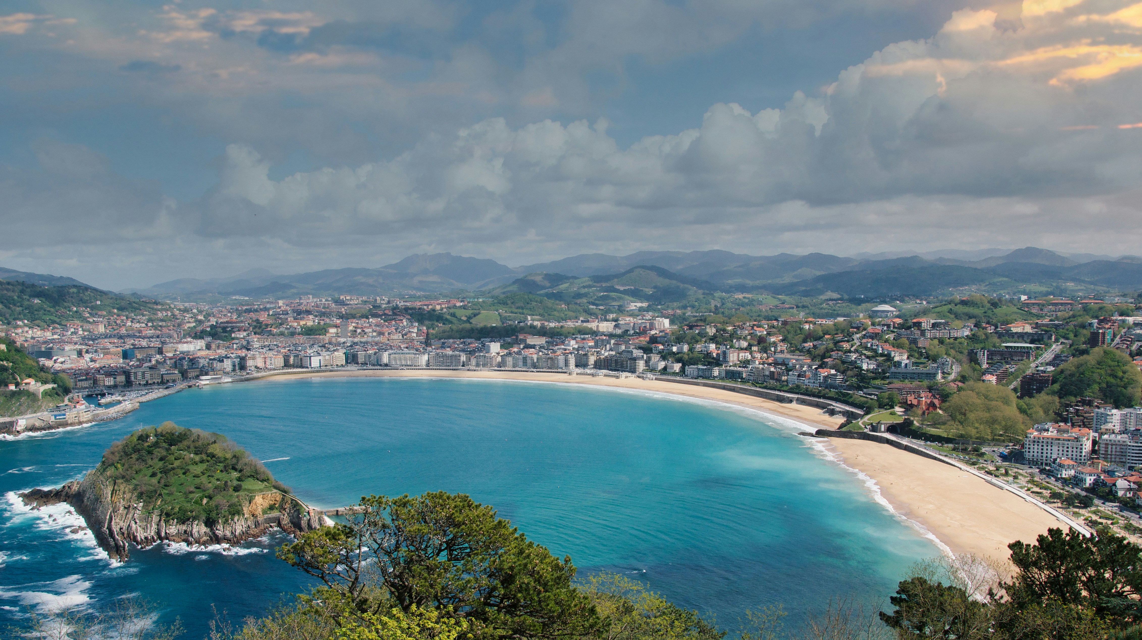 aerial view of city near body of water during daytime, Bay of San-Sebastian. Spanish Basque Country