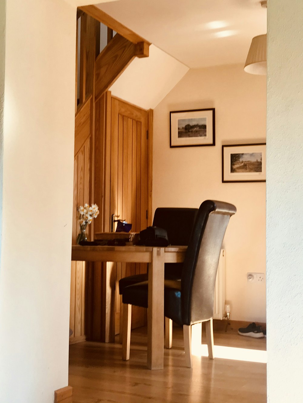 black and gray chair beside brown wooden table