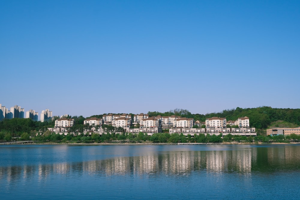 city buildings near body of water during daytime