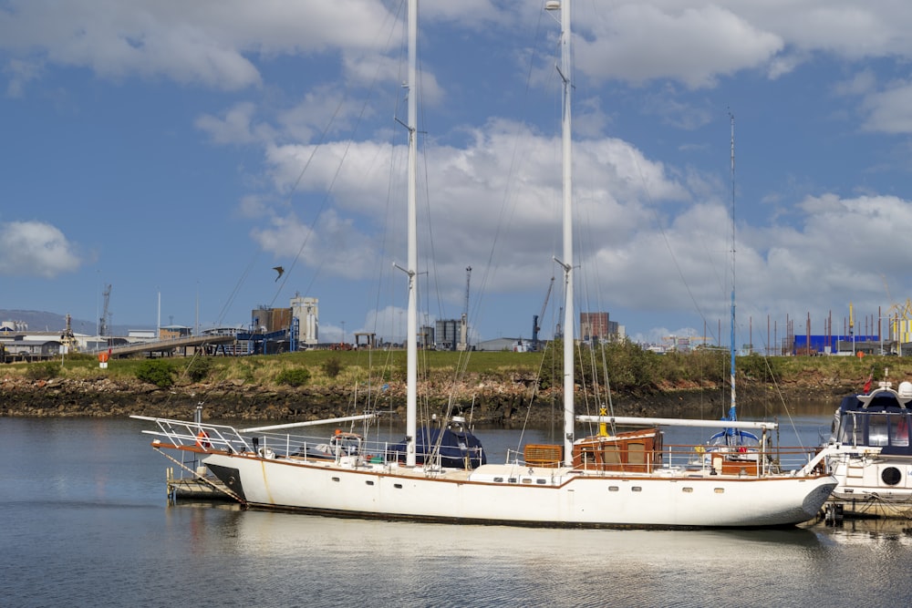 white boat on body of water during daytime