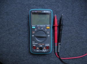 black and red electrical tester