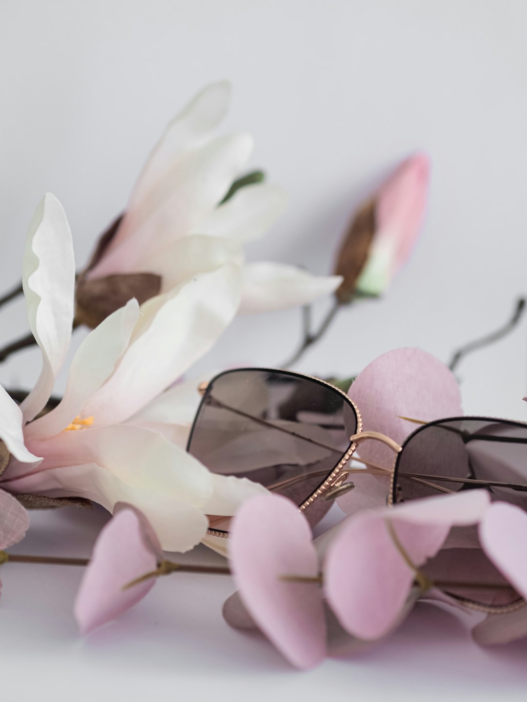 white flowers with black framed eyeglasses