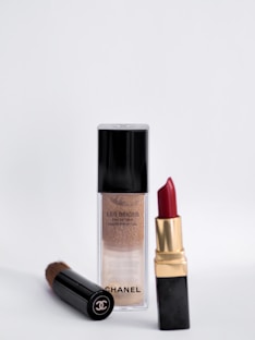 red lipstick on white surface