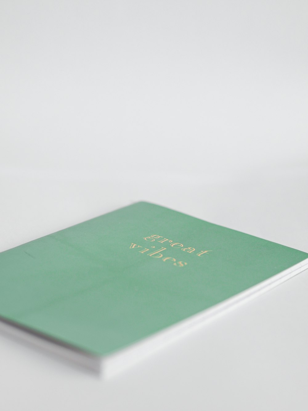 green book on white table