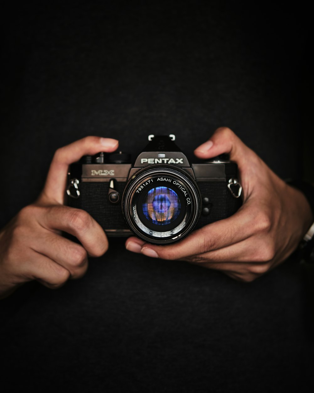 person holding black nikon dslr camera