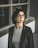 woman in black blazer wearing eyeglasses