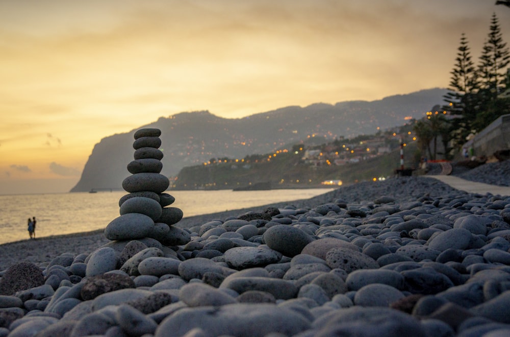 gray stones on seashore during daytime