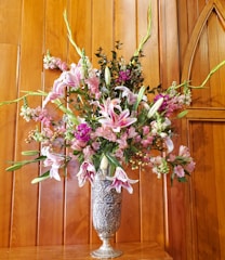 A beautifully designed floor vase filled with fresh flowers.