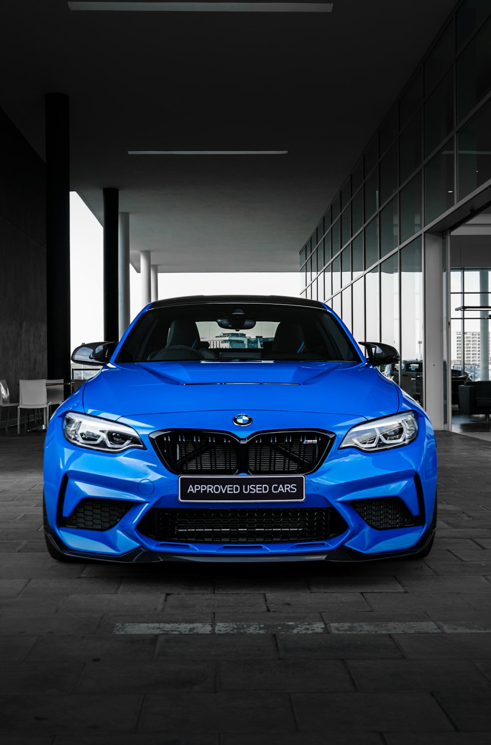 blue bmw m 3 coupe parked in garage